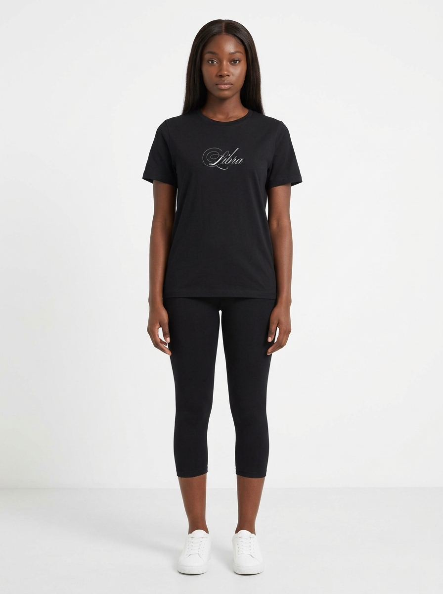 Model in the Libra Black Top with black capris