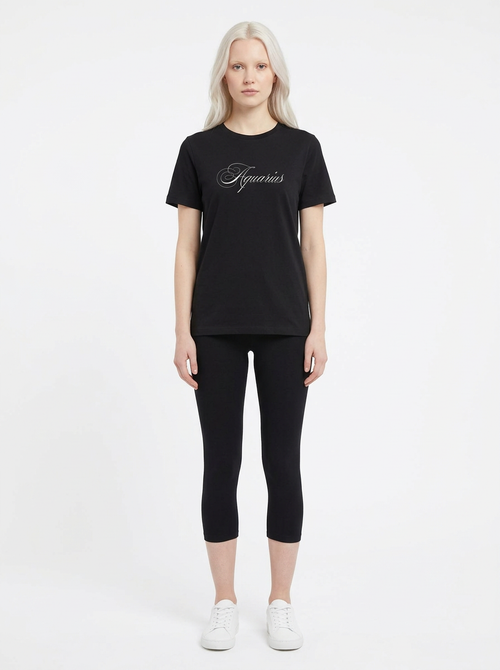 Model in the Aquarius Black Top with black capris