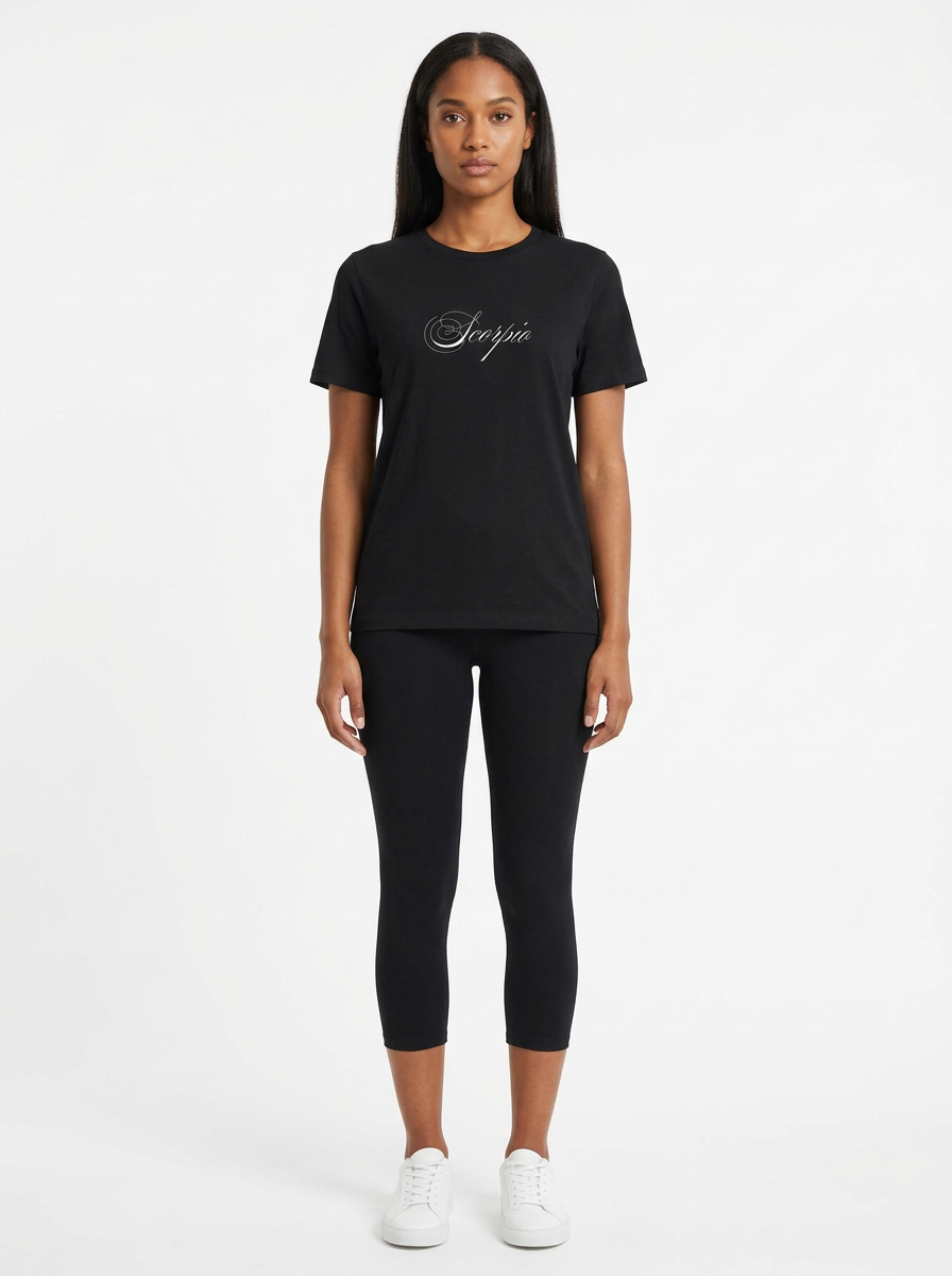 Model in the Scorpio Black Top with black capris