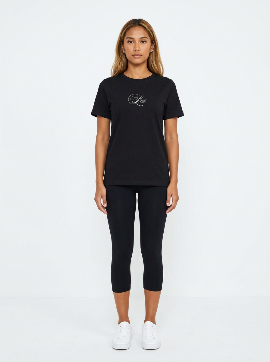 Model in the Leo Black Top with black capris