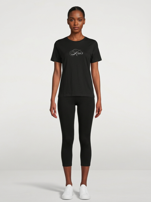 Model in the Aries Black Top with black capris