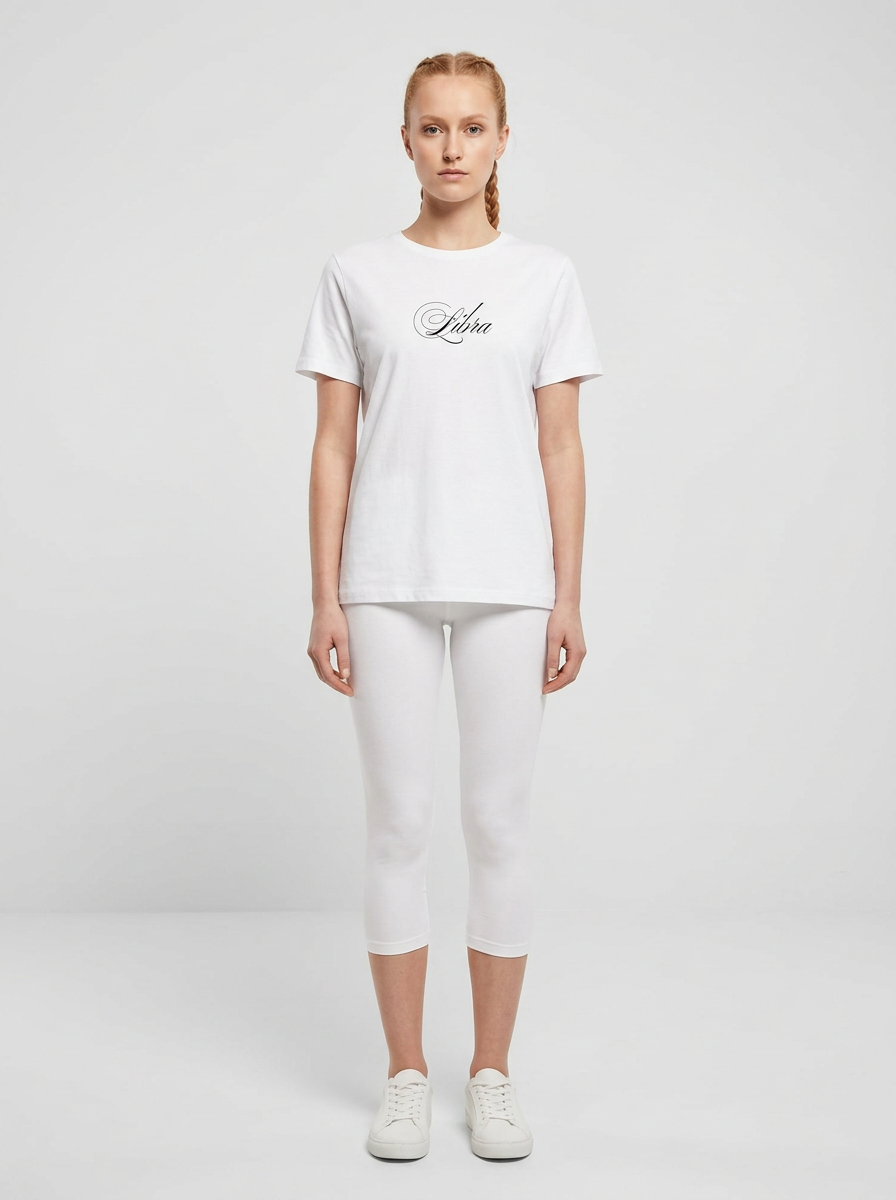 Model in the Libra White Top with white capris