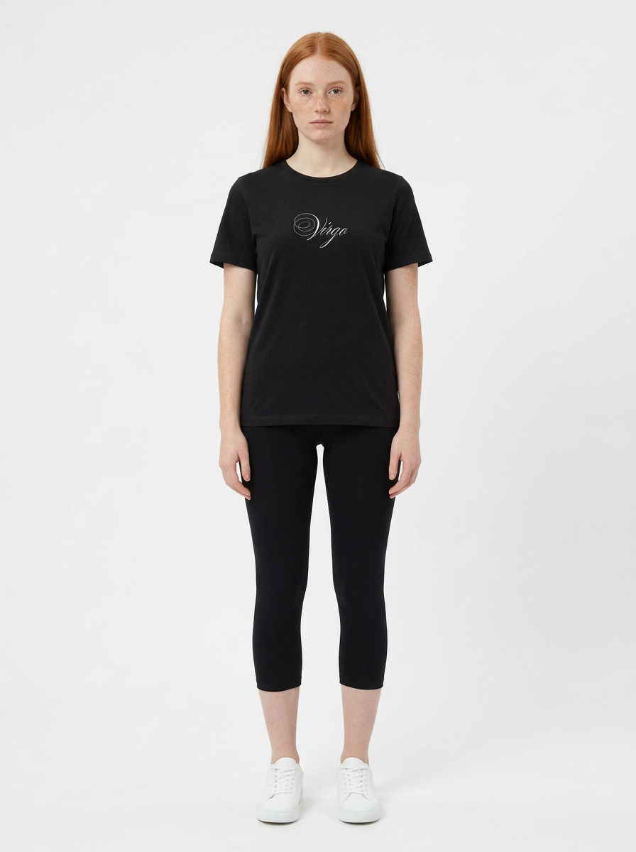 Model in the Virgo Black Top with black capris