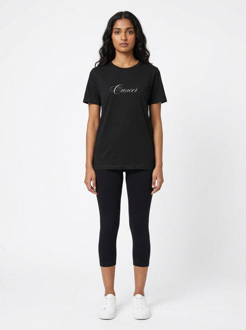 Model in the Cancer Black Top with black capris