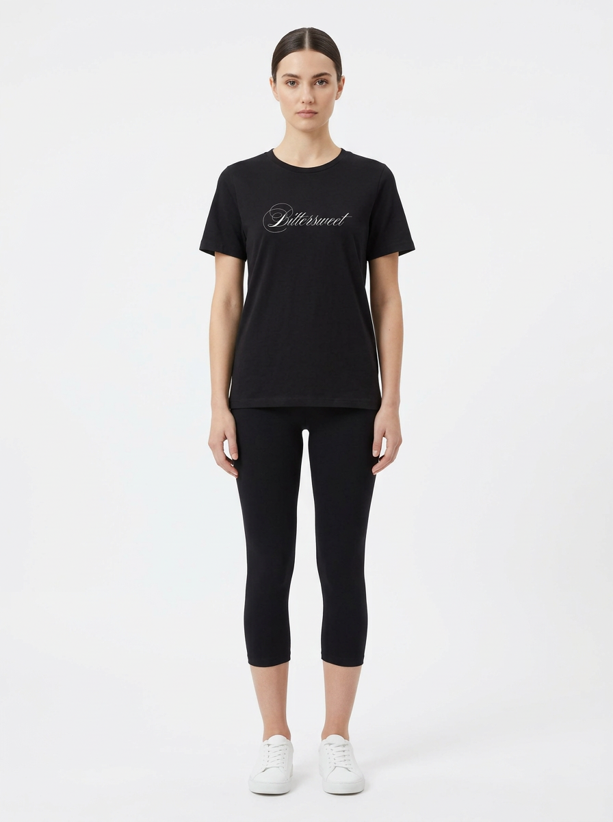 Model in the Bittersweet Black Top with black capris